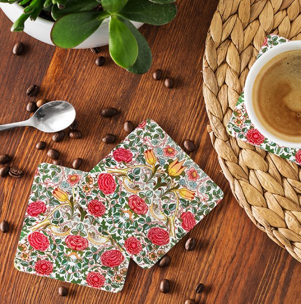 Set of coasters with William Morris design and coffee beans on table