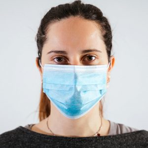 Woman wearing disposable face mask.