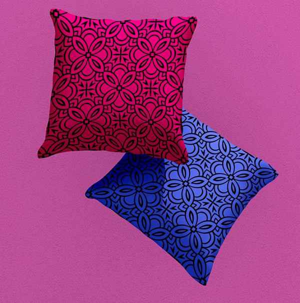 2 cushions with geometric pattern in pink and blue.