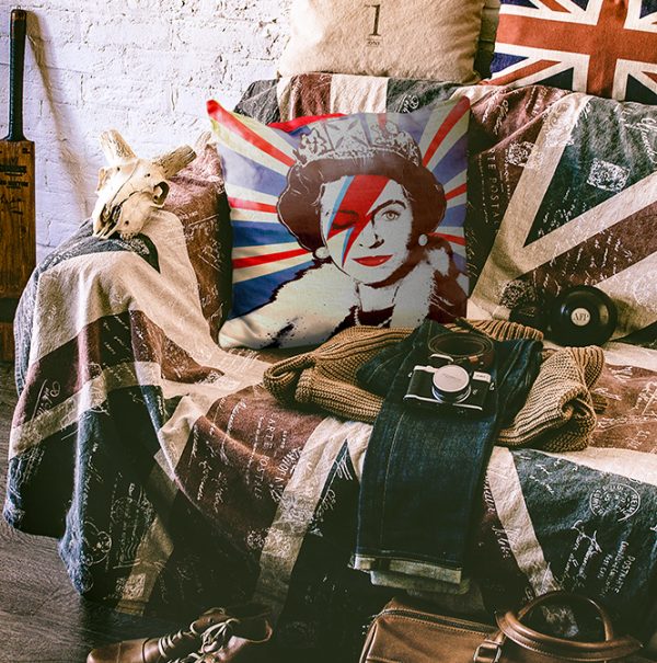 Union jack cushion on chair with face of Queen onunion jack chair with throw.